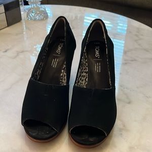 Tom’s black suede peep toe wedge.